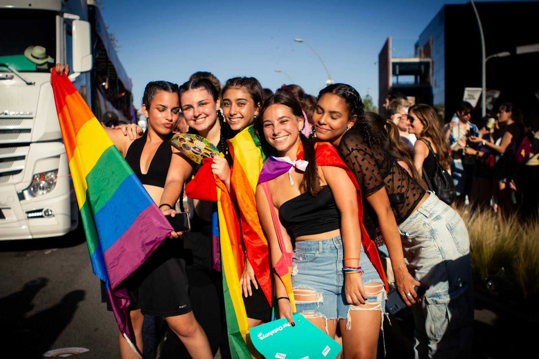 a group of people with rainbow flags