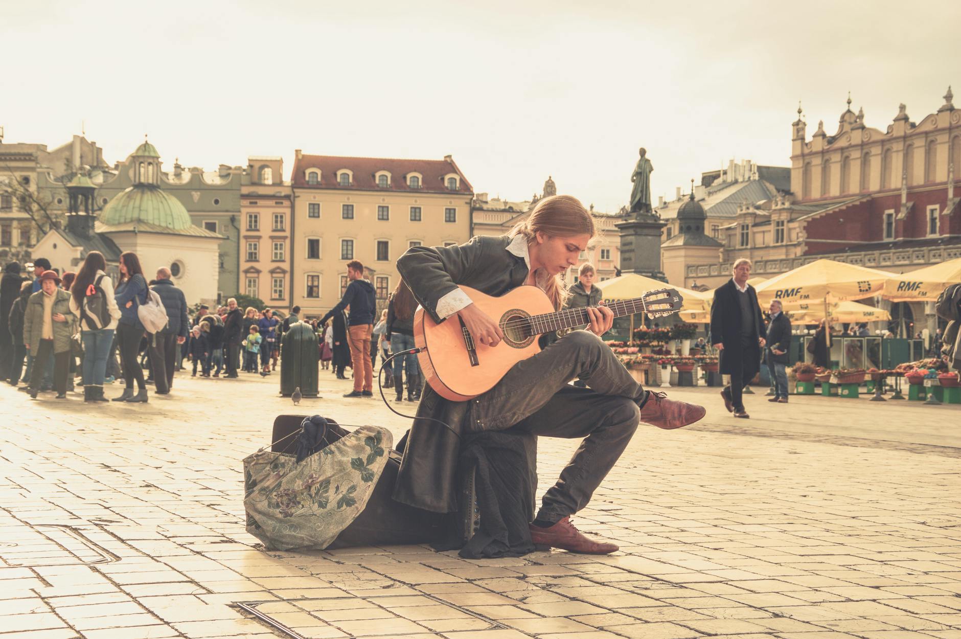 man playing acoustic guitar