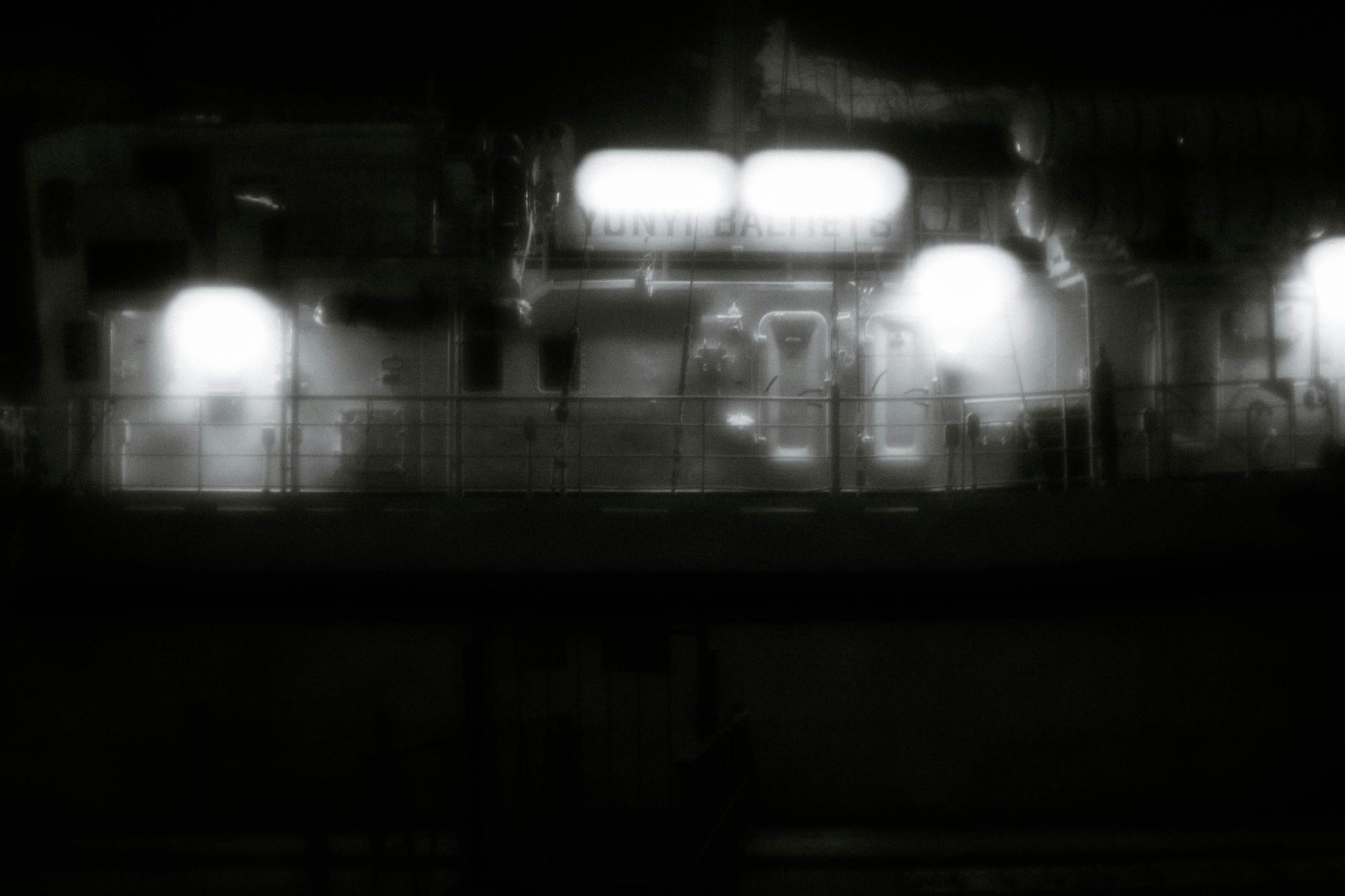 black and white blurry photo of abandoned factory