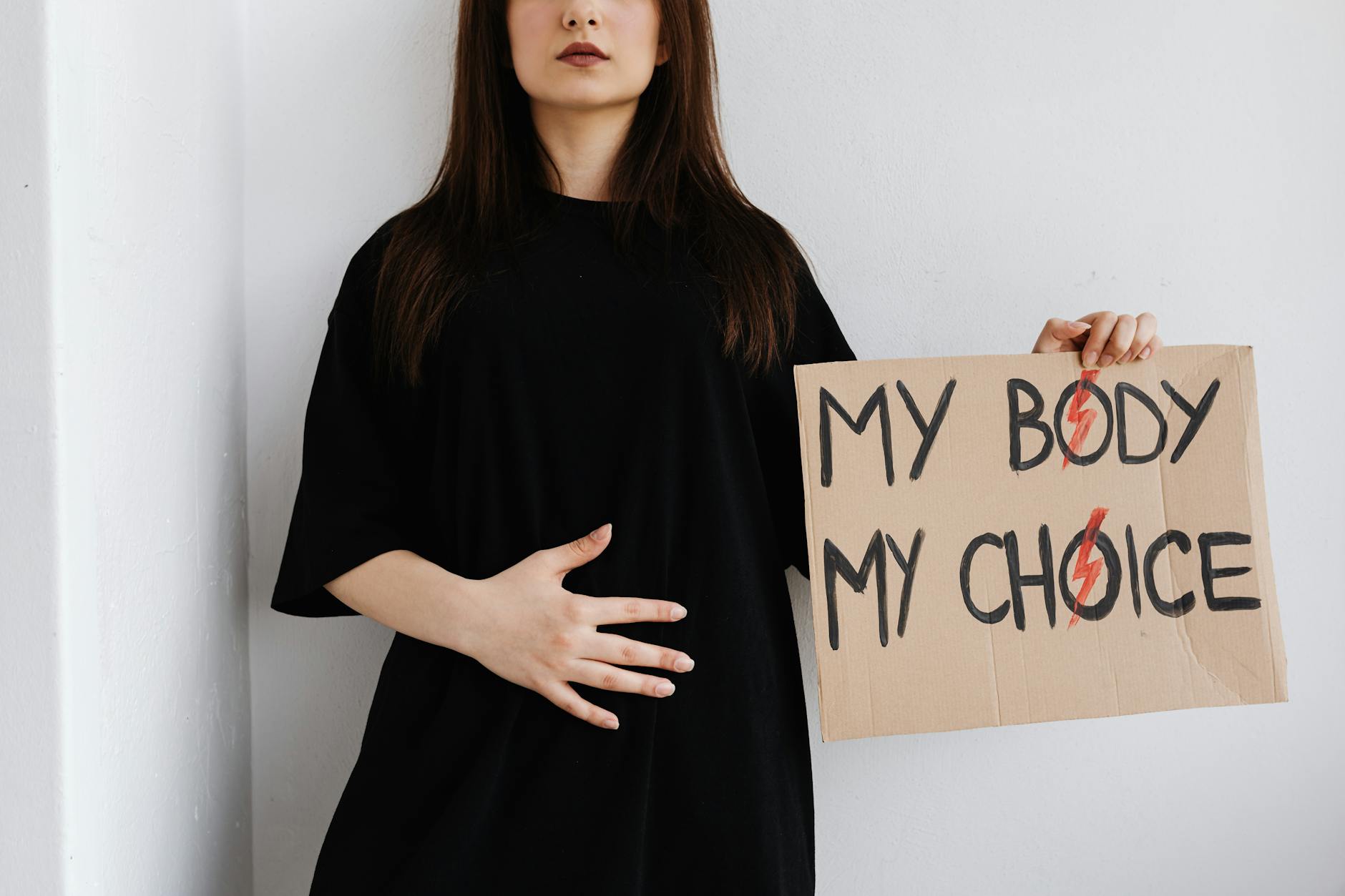 person wearing an oversized black shirt
